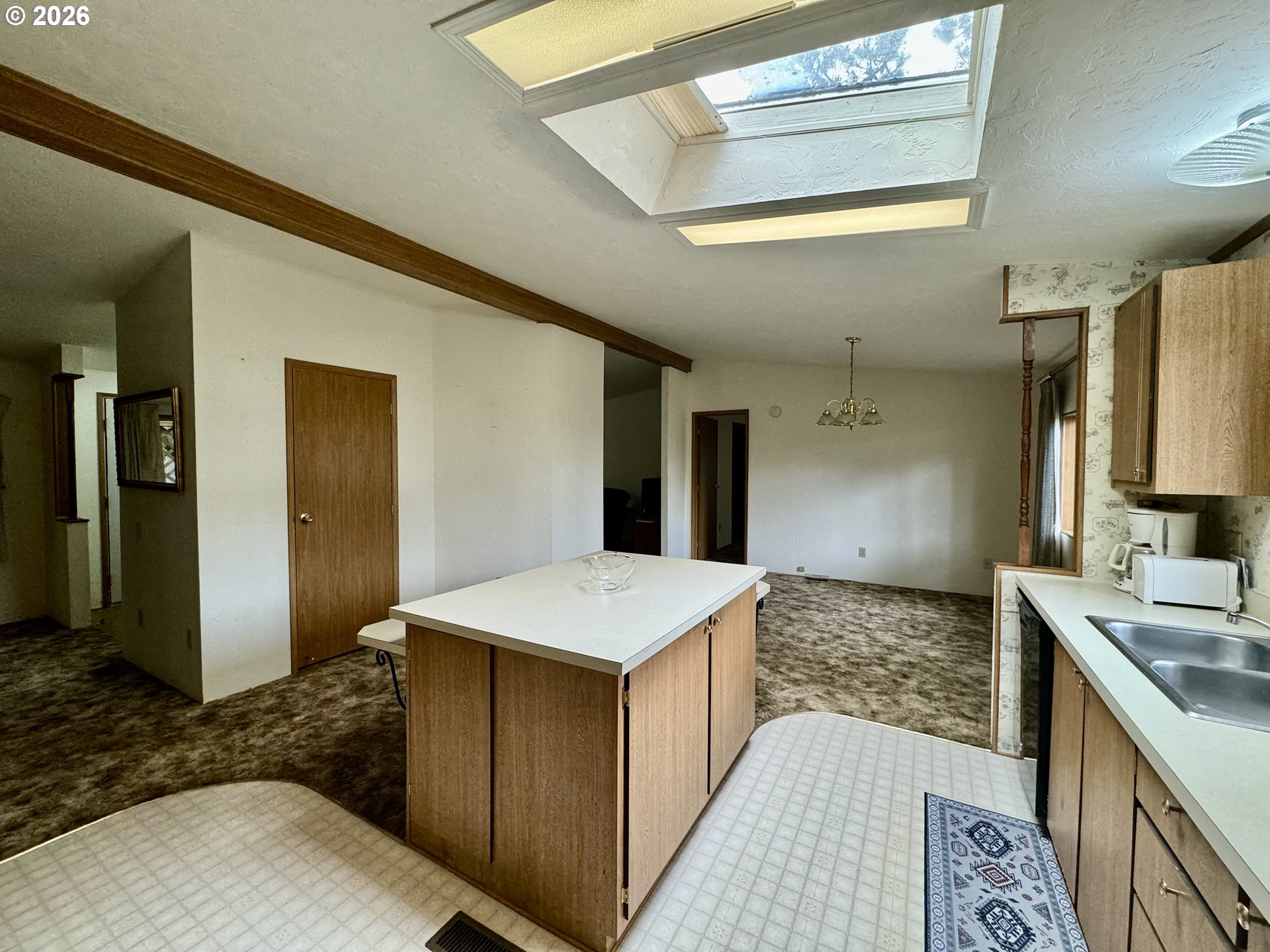 1600 Rhododendron Drive, Unit 245 Florence, OR 97439 - Photo 16 of 47 a spacious bathroom with a granite countertop sink and a mirror