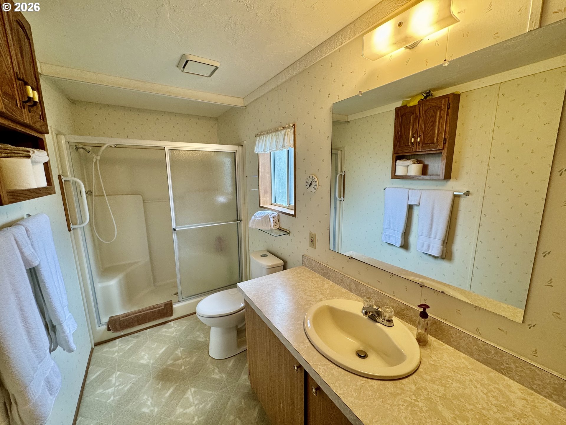 1600 Rhododendron Drive, Unit 245 Florence, OR 97439 - Photo 23 of 47 a bathroom with a sink toilet and shower