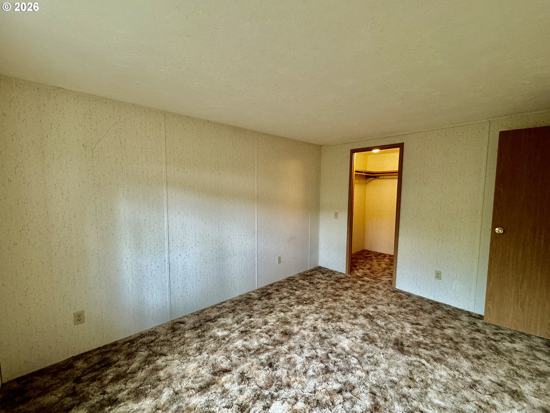 1600 Rhododendron Drive, Unit 245 Florence, OR 97439 - Photo 27 of 47 a view of a room with a wooden wall and a window