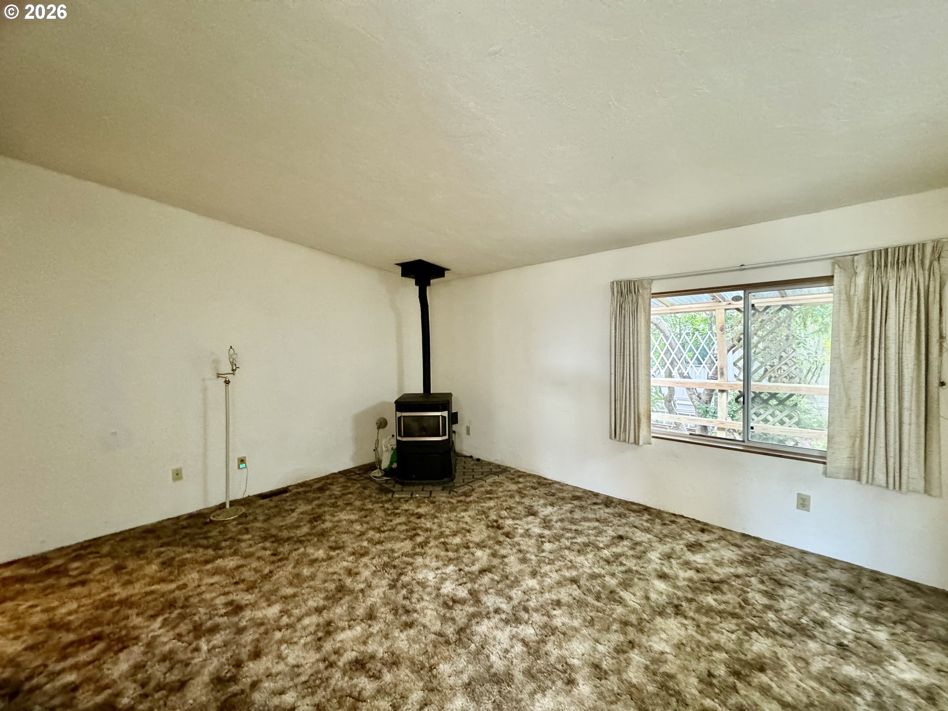 1600 Rhododendron Drive, Unit 245 Florence, OR 97439 - Photo 10 of 47 a view of a room with window and wooden floor