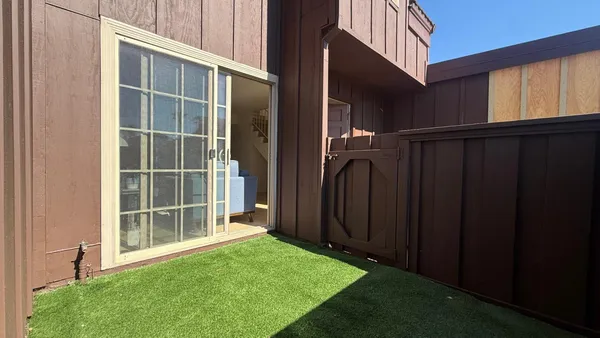 a view of front door and yard