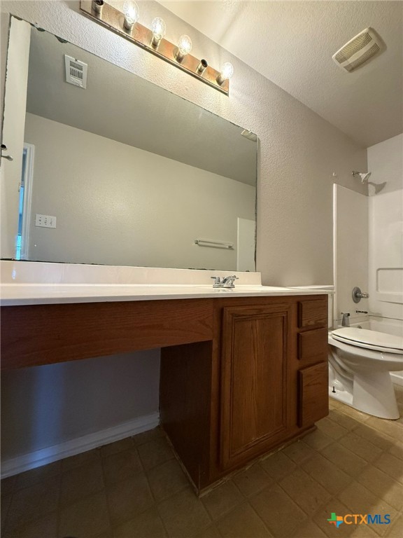 8716 Starview Street Temple, TX 76502 - Photo 17 of 20 a bathroom with a sink a toilet and a mirror