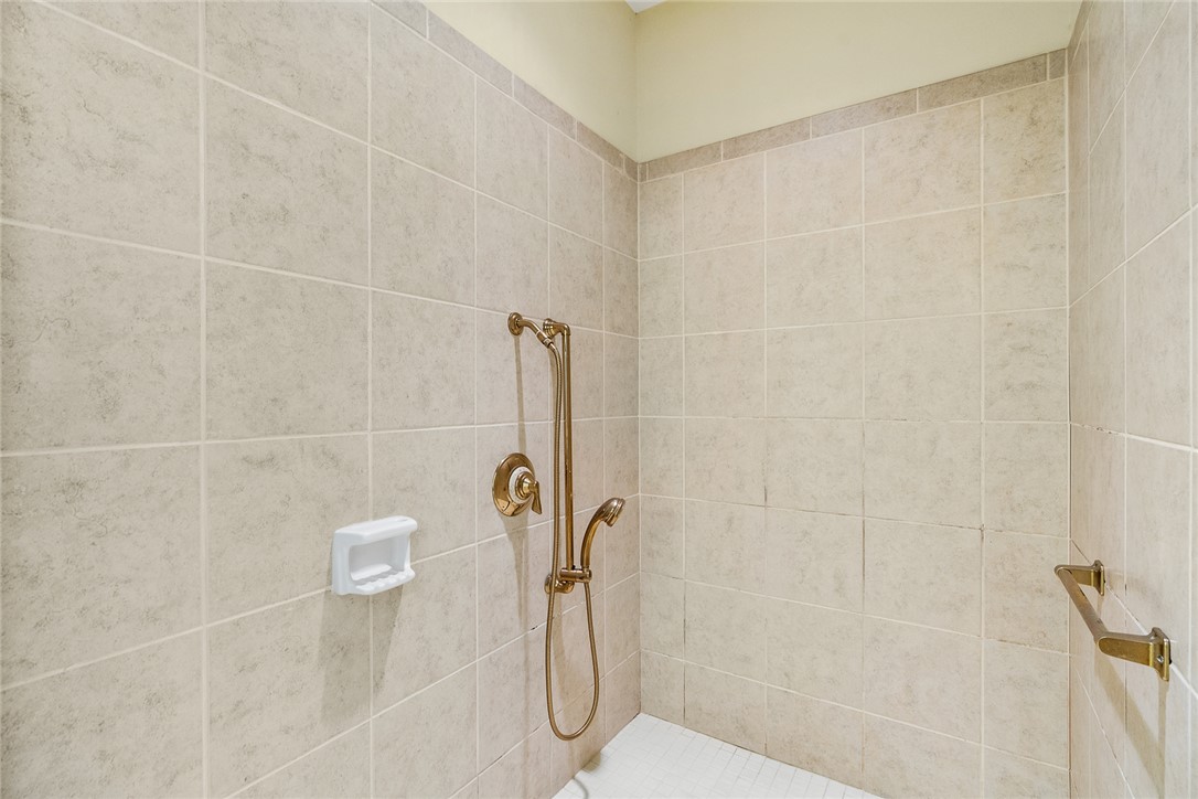 135 Sunset Bay Boulevard Seneca, SC 29672 - Photo 25 of 50 Step into this shower with classic tile work and elegant brass fixtures.