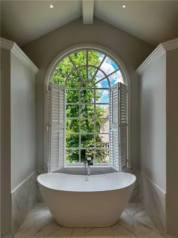 a white bath tub sitting in a bathroom