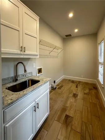 a kitchen that has a sink and a stove