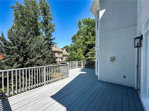 a view of a balcony with wooden floor