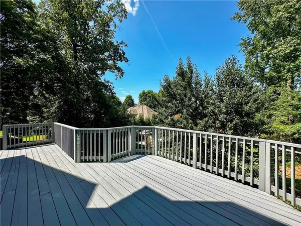 a view of deck with wooden floor and fence