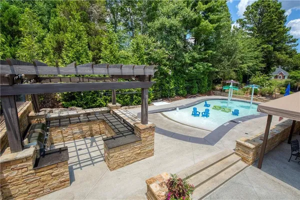 an outdoor sitting area with furniture