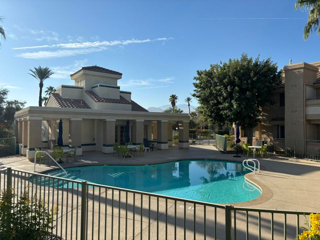 a view of a house with a yard from a balcony