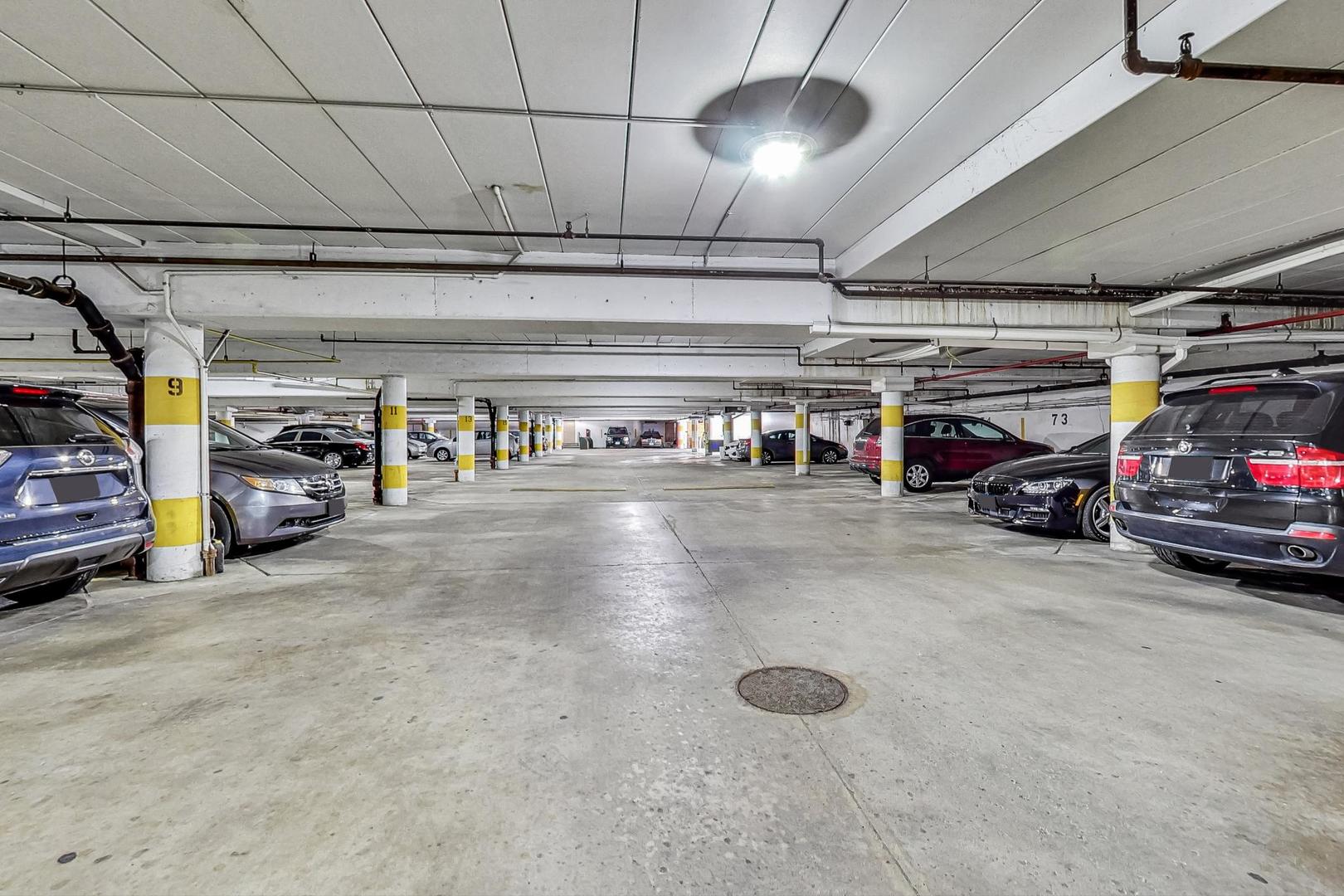 1931 Prairie Square, Unit 108 Schaumburg, IL 60173 - Photo 39 of 40 a view of parking garage with cars