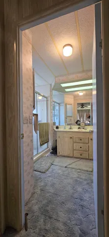 a view of a kitchen with kitchen island and living room