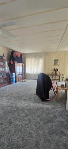 a view of a livingroom with furniture