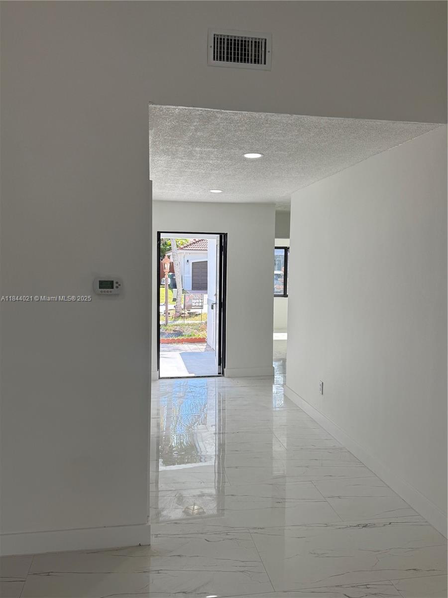 15921 Southwest 82nd Street Miami, FL 33193 - Photo 13 of 22 a view of an empty room