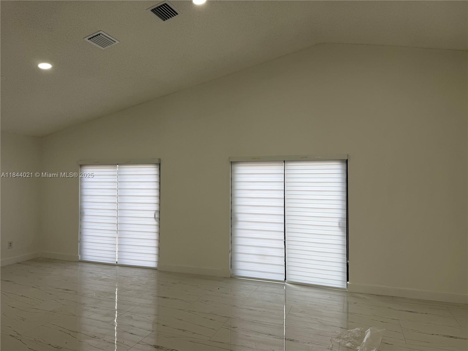 15921 Southwest 82nd Street Miami, FL 33193 - Photo 19 of 22 an empty room with windows