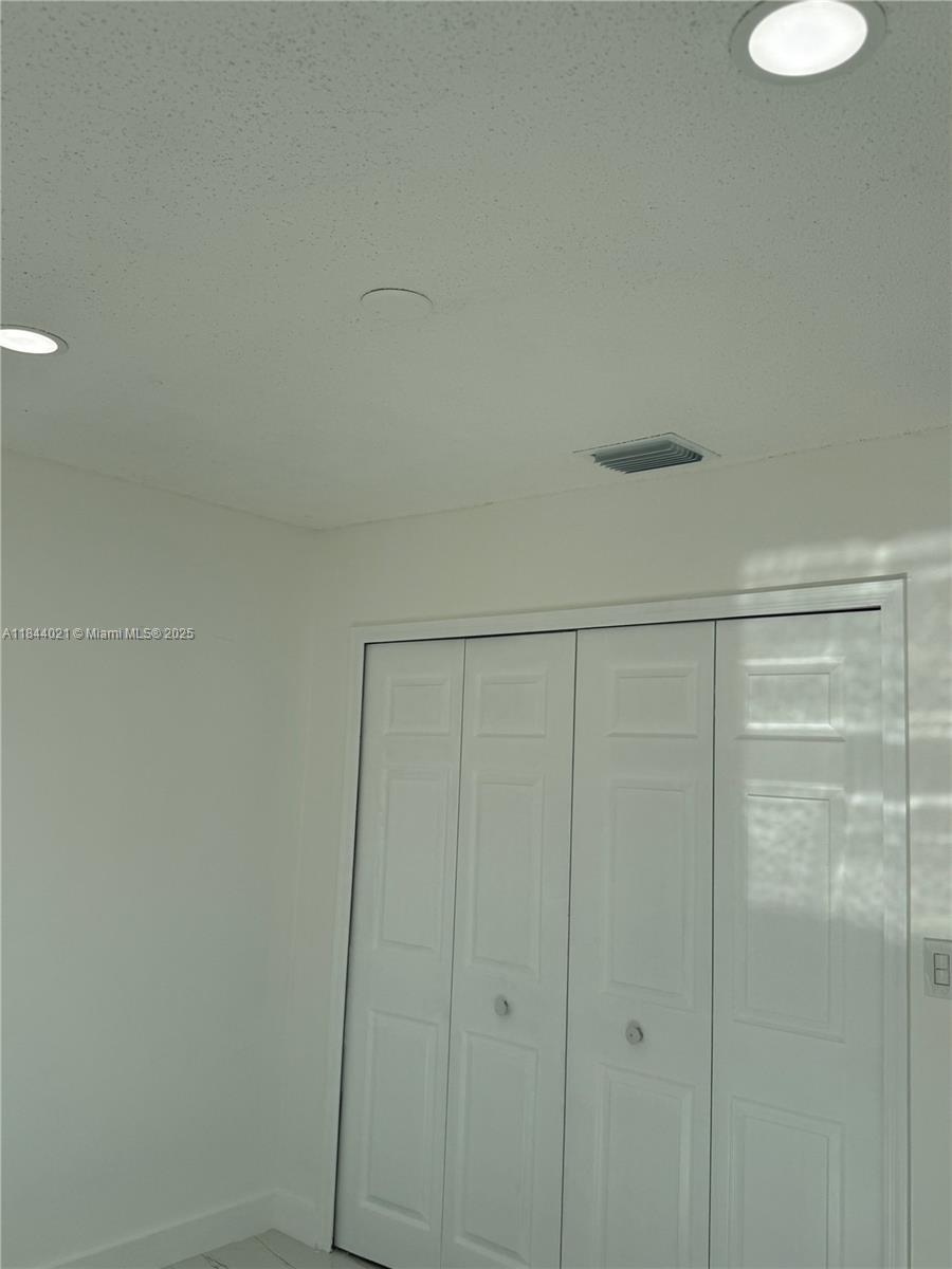 15921 Southwest 82nd Street Miami, FL 33193 - Photo 9 of 22 a bathroom with a shower