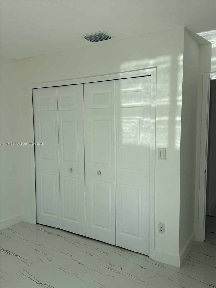 15921 Southwest 82nd Street Miami, FL 33193 - Photo 10 of 22 a view of an empty room