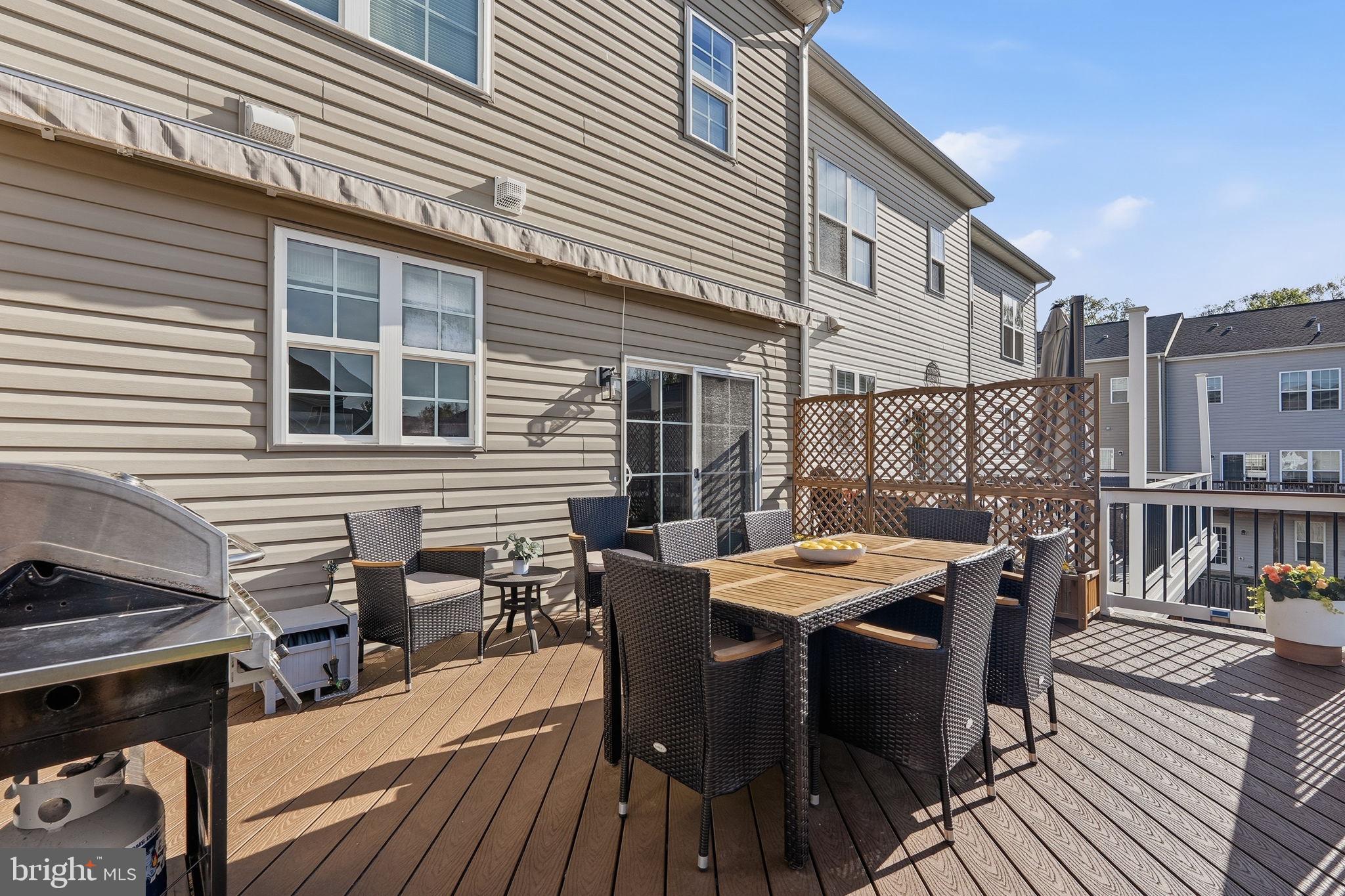 204 Miles Hawk Terrace Purcellville, VA 20132 - Photo 19 of 40 a view of a patio with table and chairs and wooden floor