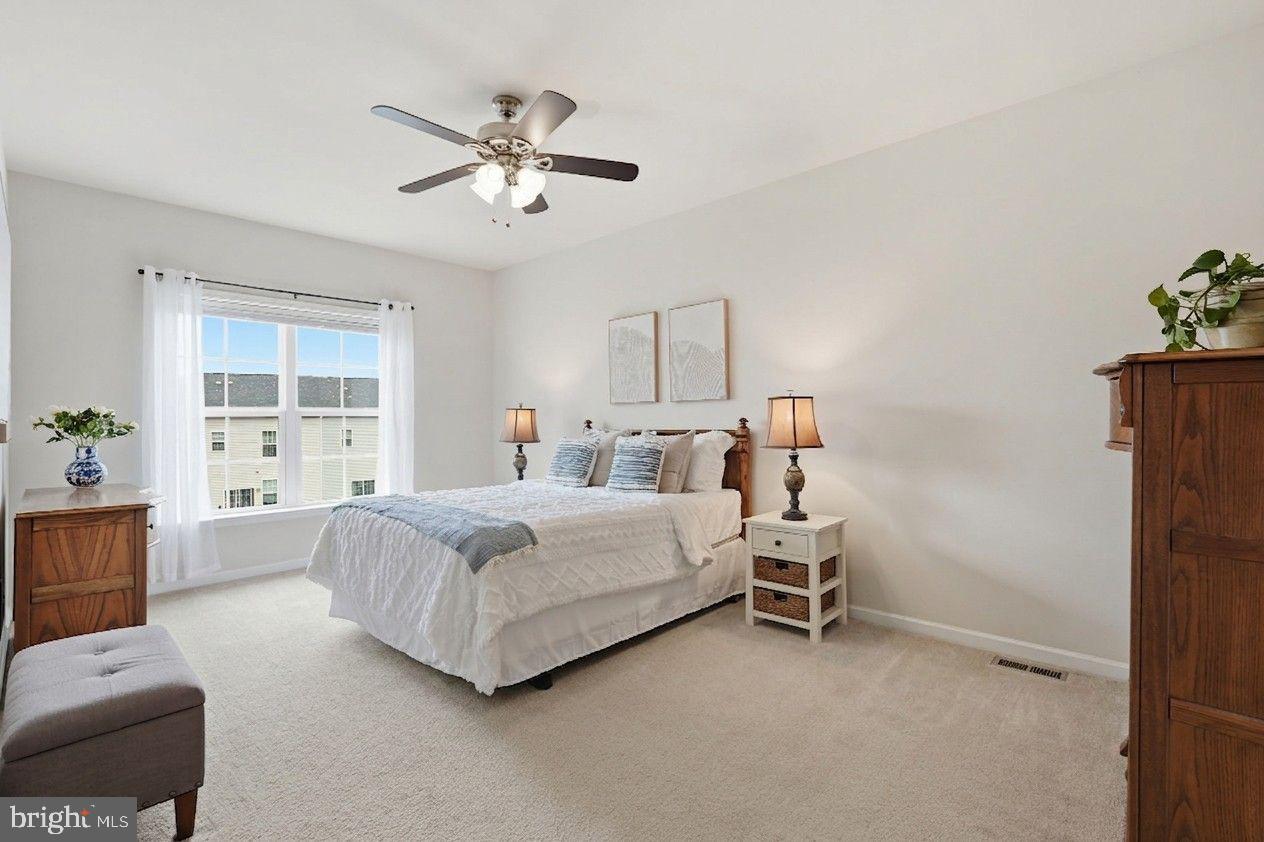 204 Miles Hawk Terrace Purcellville, VA 20132 - Photo 21 of 40 a bedroom with a bed furniture and window