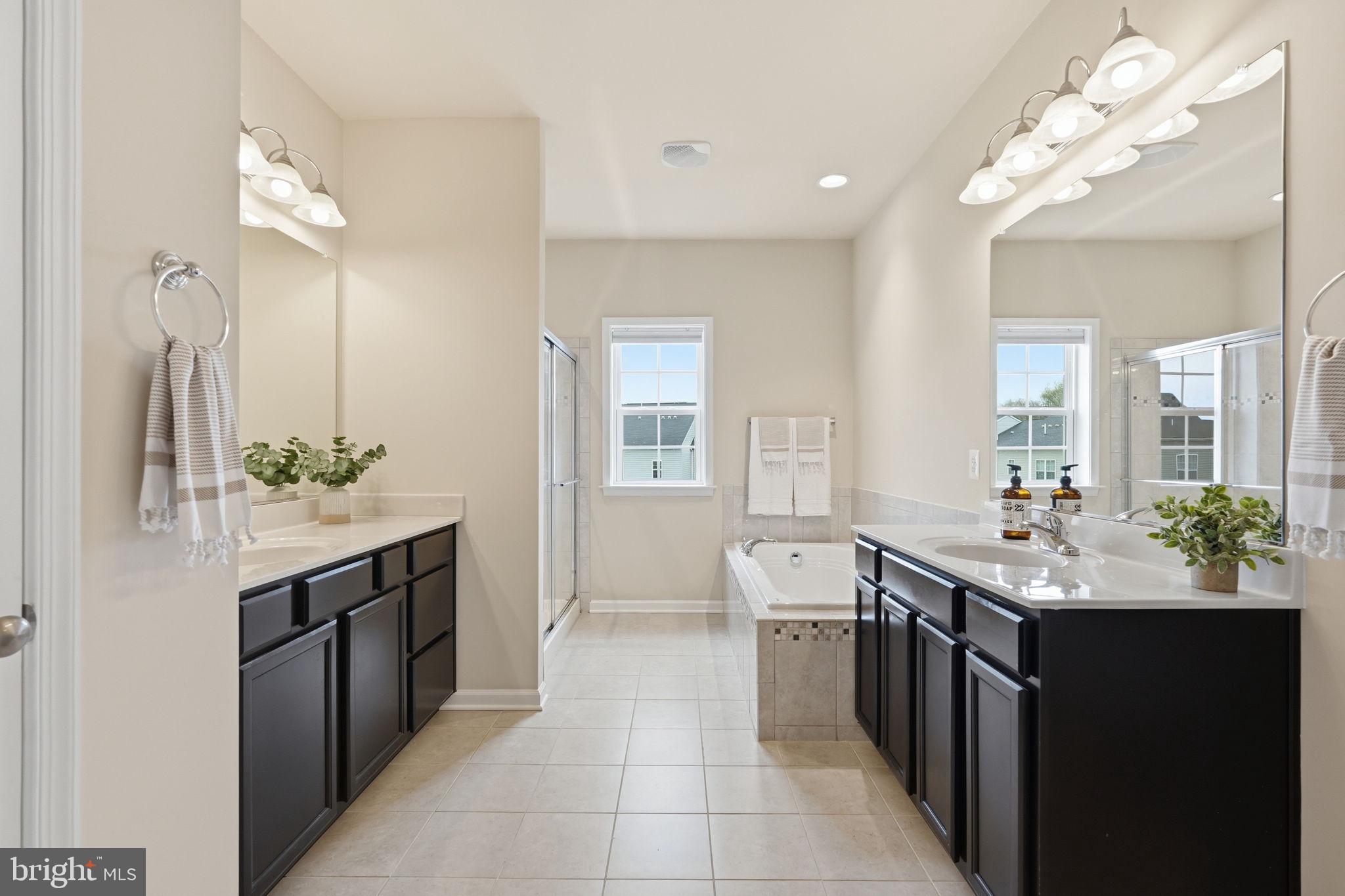 204 Miles Hawk Terrace Purcellville, VA 20132 - Photo 24 of 40 a kitchen with a sink counter top space and cabinets