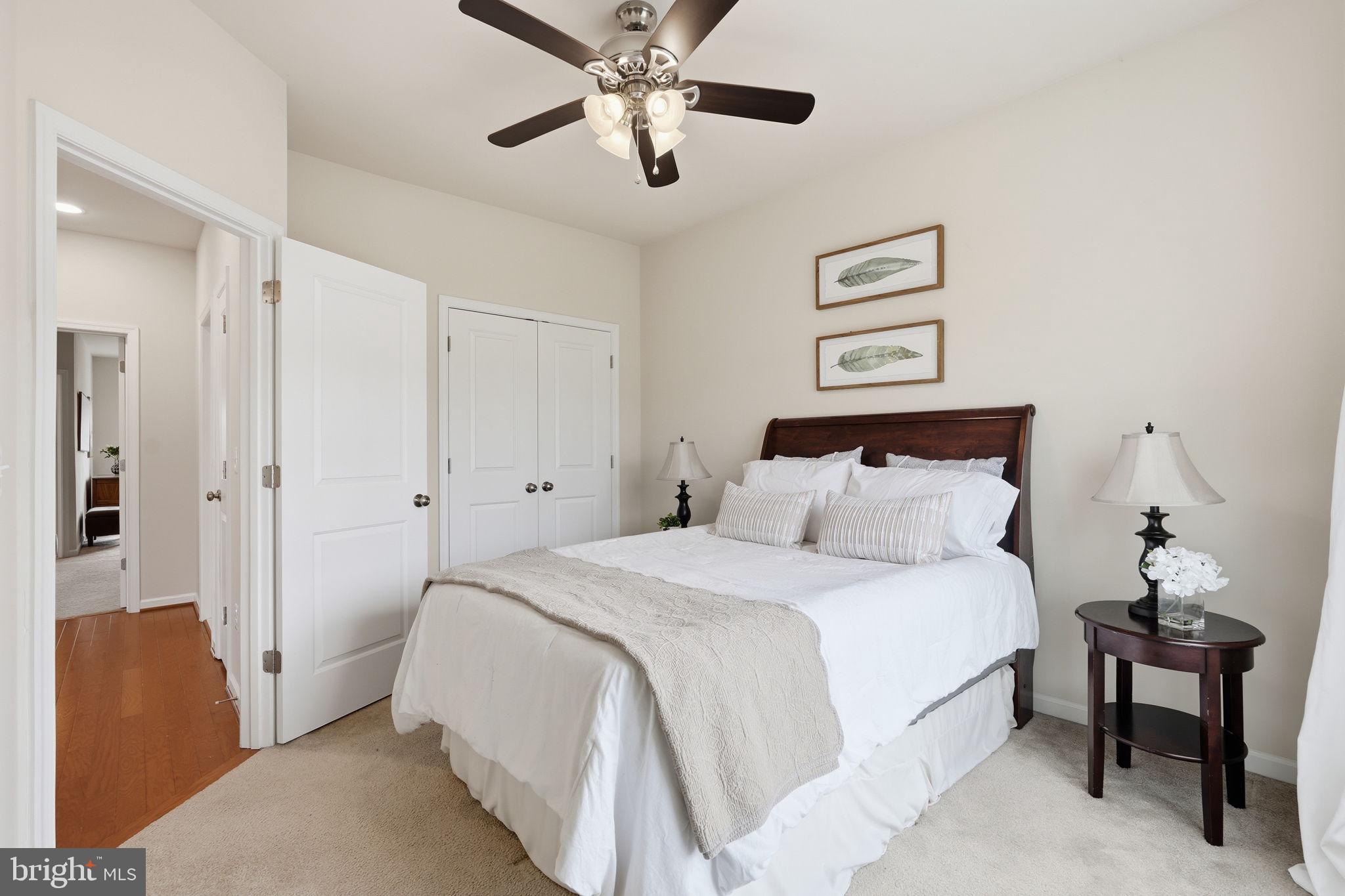 204 Miles Hawk Terrace Purcellville, VA 20132 - Photo 30 of 40 a bedroom with bed and a chandelier