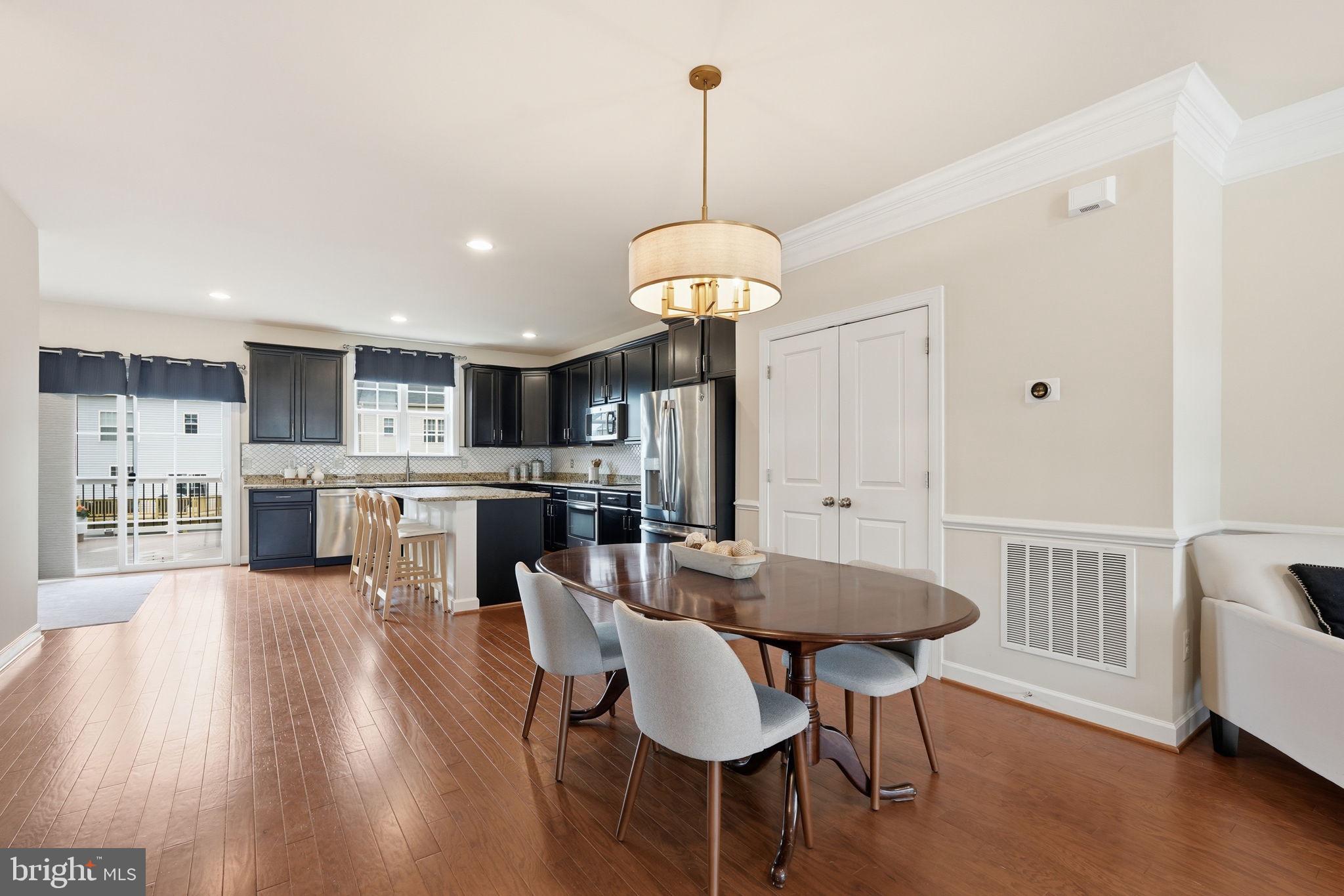 204 Miles Hawk Terrace Purcellville, VA 20132 - Photo 8 of 40 a dining room with furniture and wooden floor