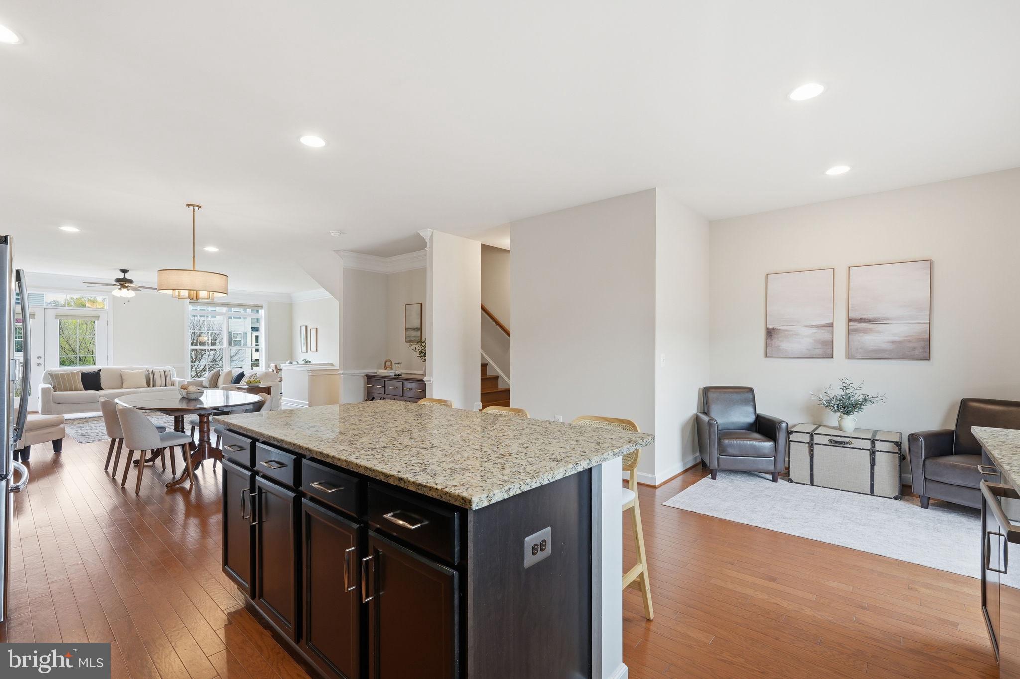 204 Miles Hawk Terrace Purcellville, VA 20132 - Photo 10 of 40 a dining hall with stainless steel appliances granite countertop a stove and a dining table with the kitchen view