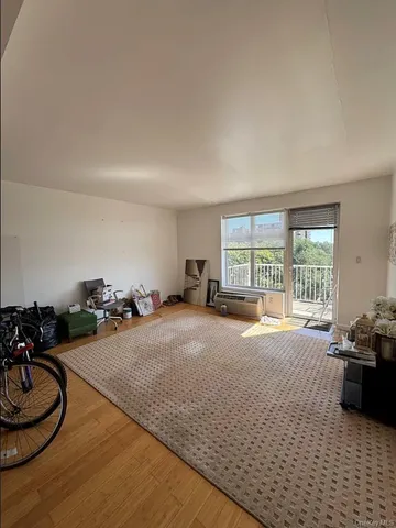 a bed room with furniture and a window