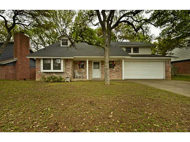 8421 Seminary Ridge Drive Austin, TX 78745 - Photo 1 of 1 a front view of a house with garden