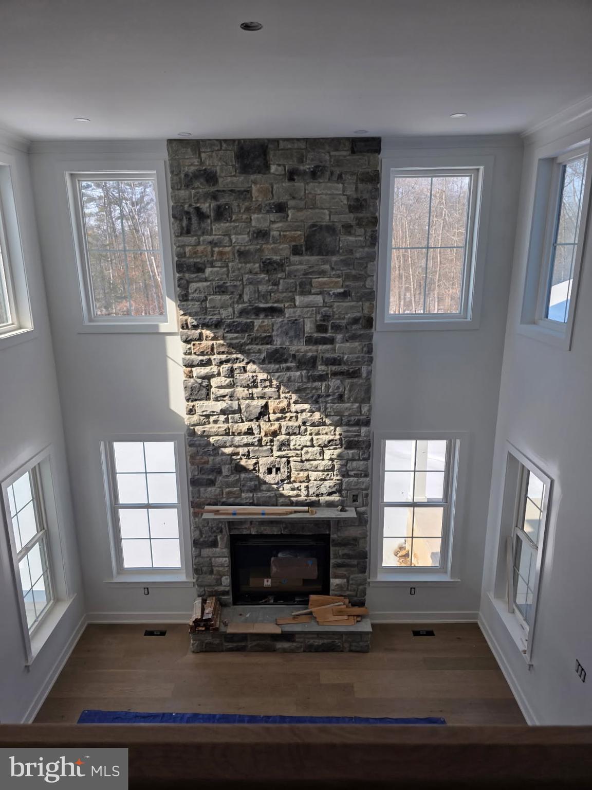 5987 Point Pleasant Pike Doylestown, PA 18902 - Photo 13 of 20 an empty room with wooden floor fireplace and windows