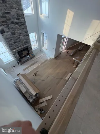a view of an empty room and wooden floor