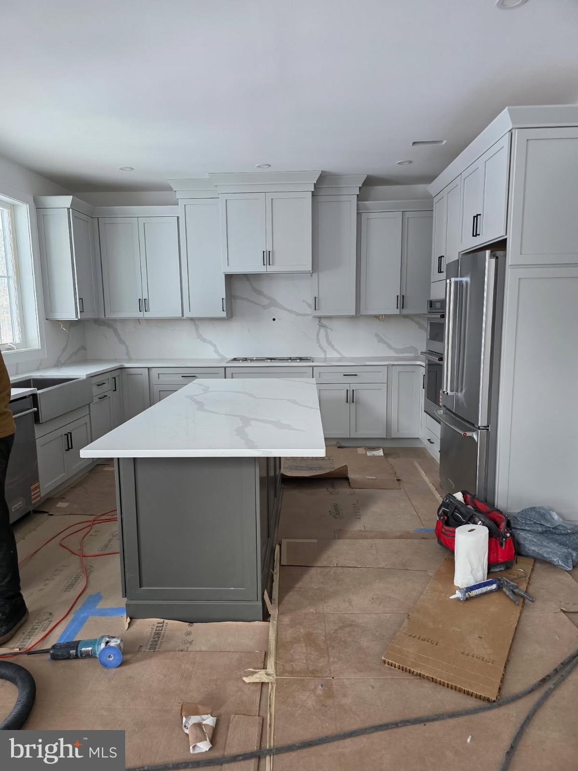 5987 Point Pleasant Pike Doylestown, PA 18902 - Photo 9 of 20 a kitchen with a sink refrigerator and cabinets