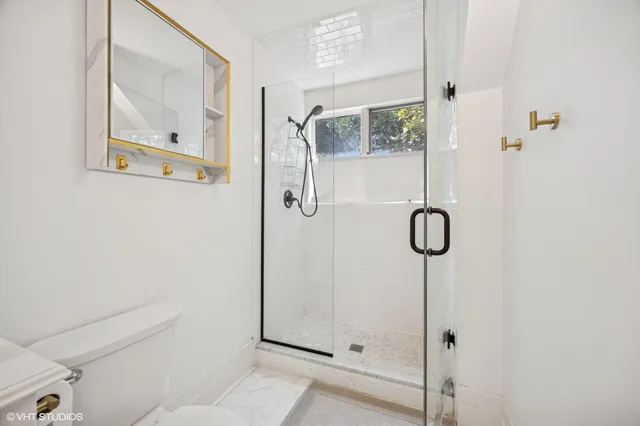 a kitchen with a sink appliances and cabinets