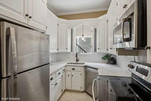 a bathroom with a double vanity sink mirror and