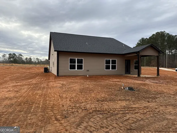 a backyard of a house with lots of green space