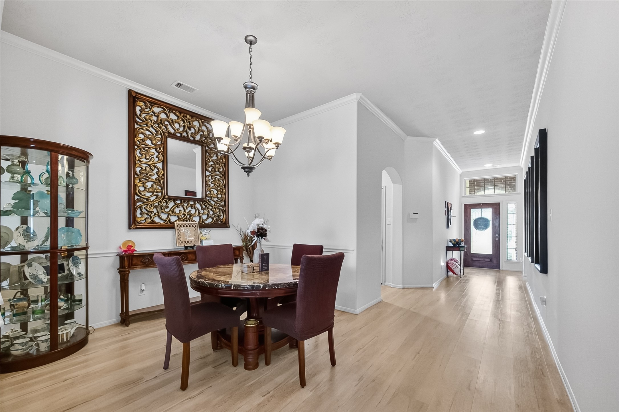 13415 Star Creek Lane Rosharon, TX 77583 - Photo 3 of 46 a view of a dining room with furniture and wooden floor