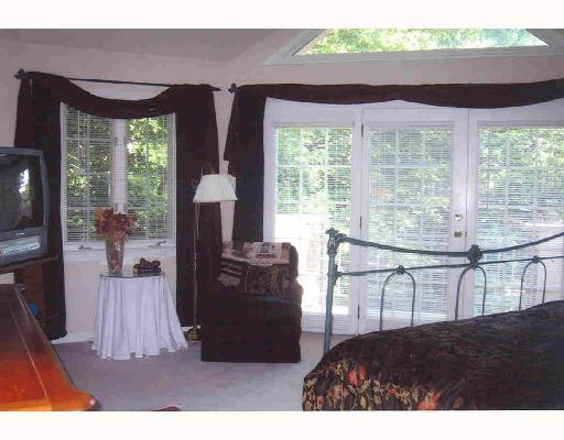 717 Chestnut Road Edgeworth, PA 15143 - Photo 7 of 8 Master Bedroom. This is really a luxorious suite with an attached sitting room/office, walk-in closet, extra large master bath with jet spray tub and separate shower. The laundry is just down the hall! And look at the pretty windows and door to small balcony!
