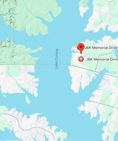 a white vase with white and yellow flowers