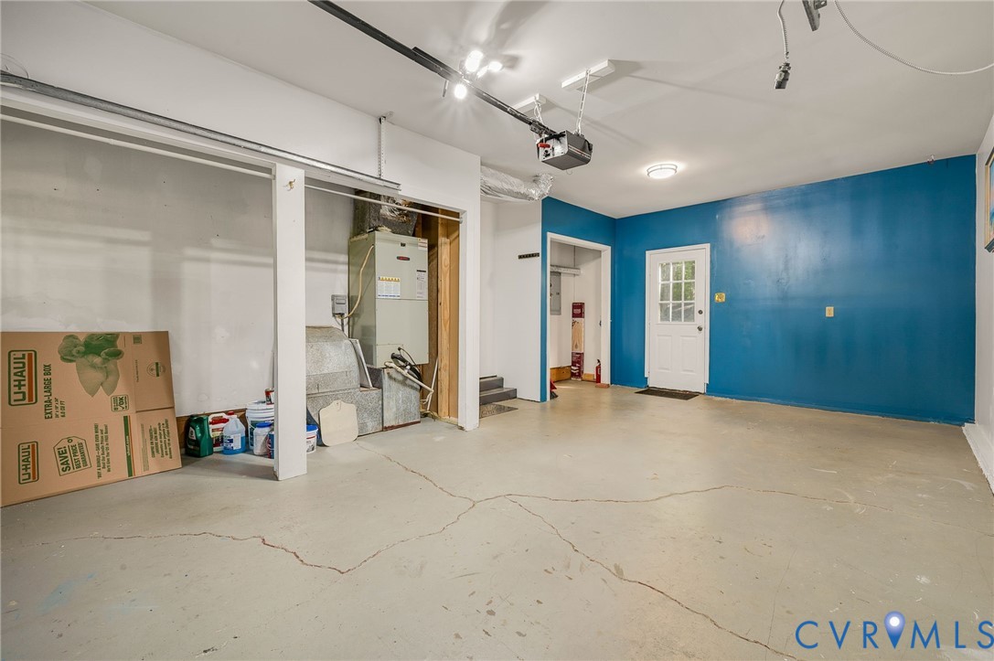 4820 Cedar Cliff Road Chester, VA 23831 - Photo 39 of 41 Spacious garage with an overhead automatic door op