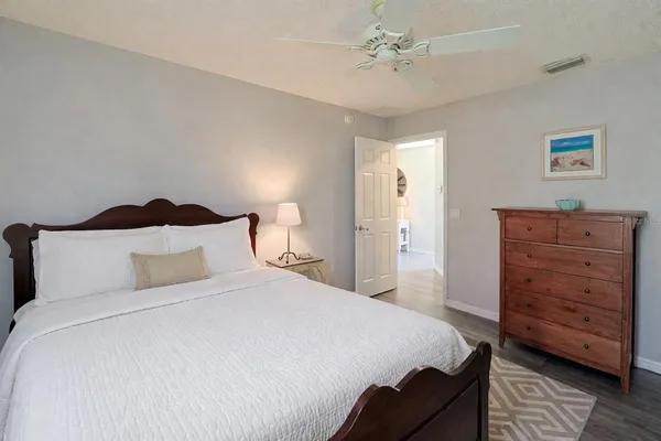 a bedroom with a bed and a dresser