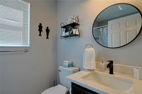 a bathroom with a toilet and a sink