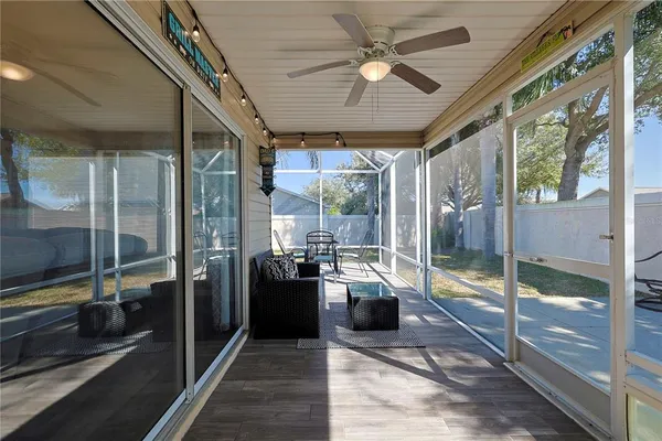 a very nice looking room with a large window and stainless steel appliances