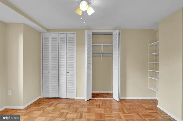 a view of a livingroom with wooden floor and closet area