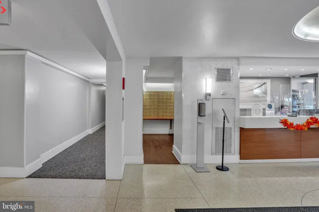 a view of a hallway with a living room