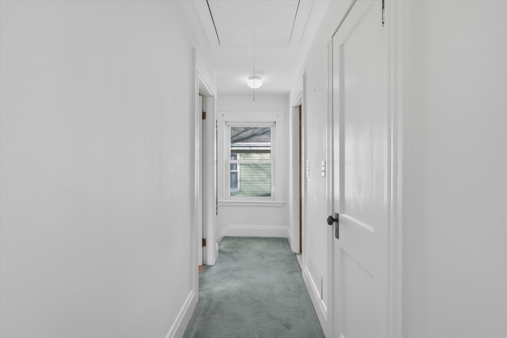 46 Wilfred Street Lynn, MA 01905 - Photo 22 of 29 a view of a hallway with white walls