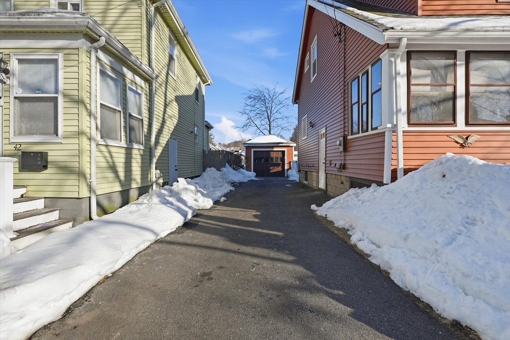 46 Wilfred Street Lynn, MA 01905 - Photo 4 of 29 a view of a house with many windows