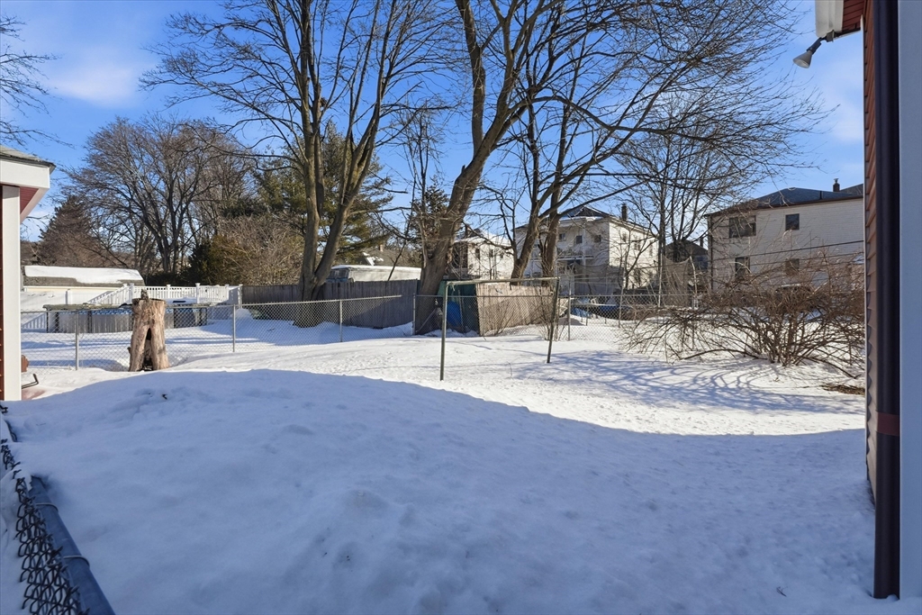 46 Wilfred Street Lynn, MA 01905 - Photo 5 of 29 a view of road with snow on the house