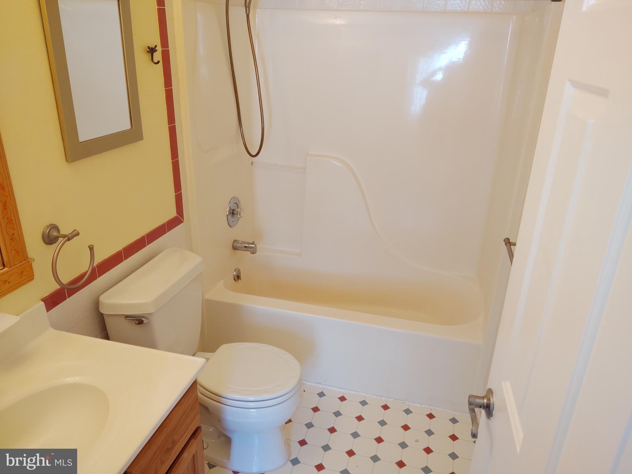 609 Mann Road Deale, MD 20751 - Photo 12 of 24 a bathroom with a toilet and a shower