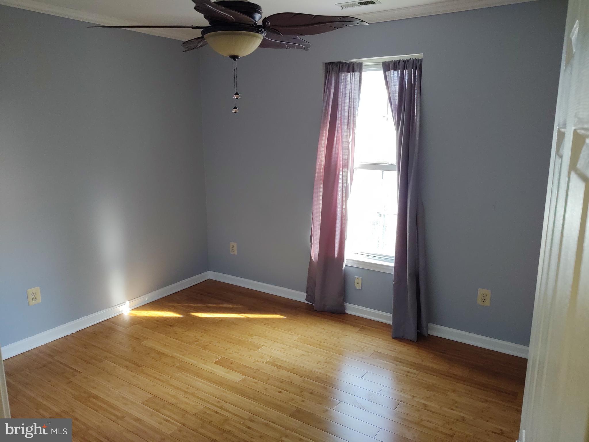 609 Mann Road Deale, MD 20751 - Photo 19 of 24 a view of empty room with wooden floor and fan