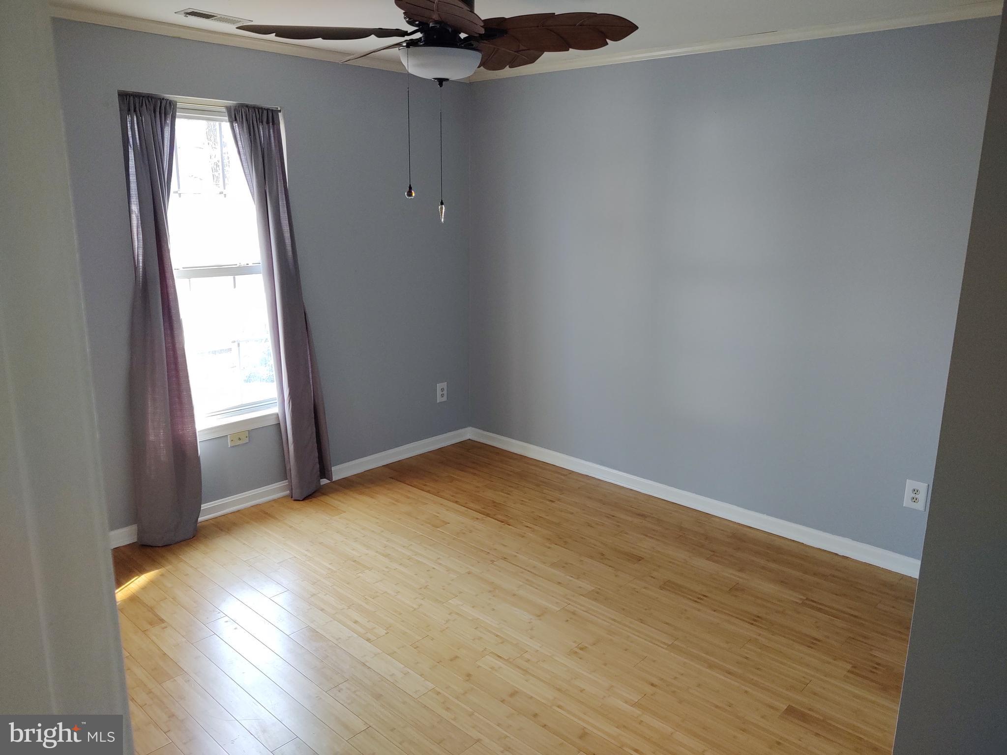 609 Mann Road Deale, MD 20751 - Photo 22 of 24 a view of empty room with wooden floor