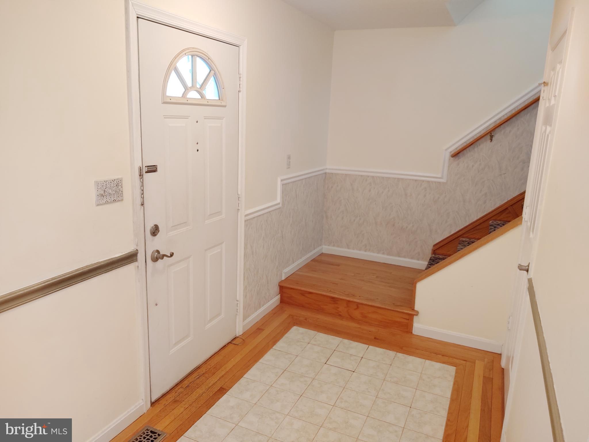 609 Mann Road Deale, MD 20751 - Photo 3 of 24 a view of empty room with wooden floor and fan